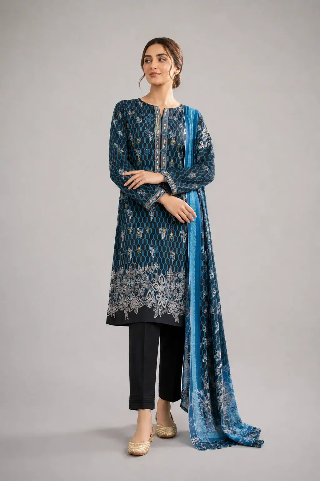 Woman wearing a blue and black Pakistani traditional outfit with a matching dupatta