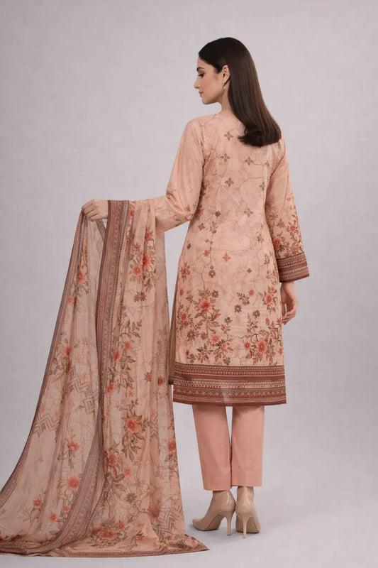 Woman wearing a peach-colored Bin Saeed lawn design with floral patterns and plain trouser