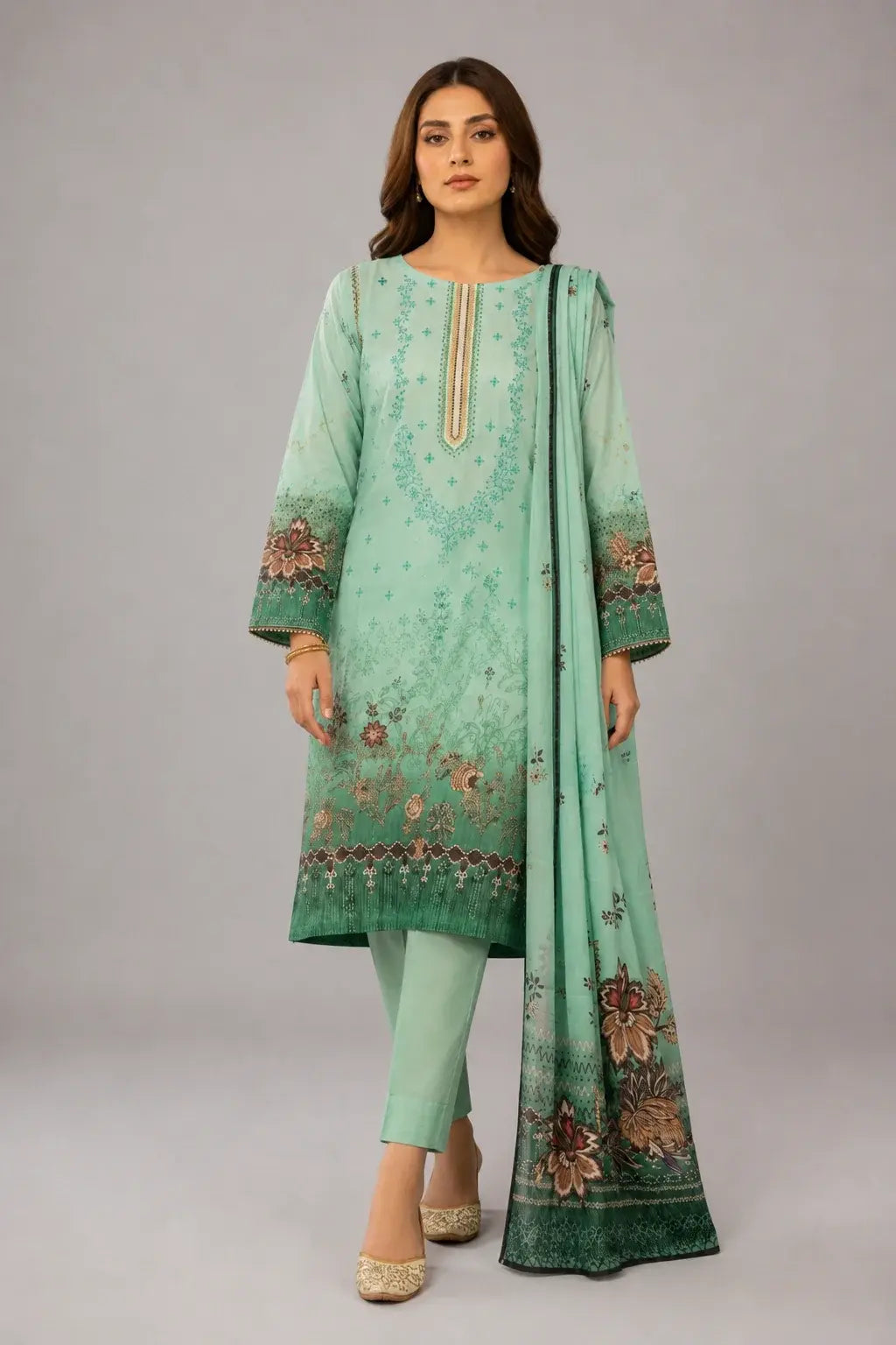 Woman wearing a mint green traditional outfit in luxury lawn