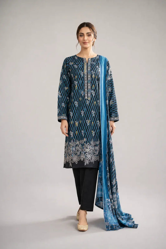 Woman wearing a blue Pakistani dress design with a matching dupatta, and black trouser