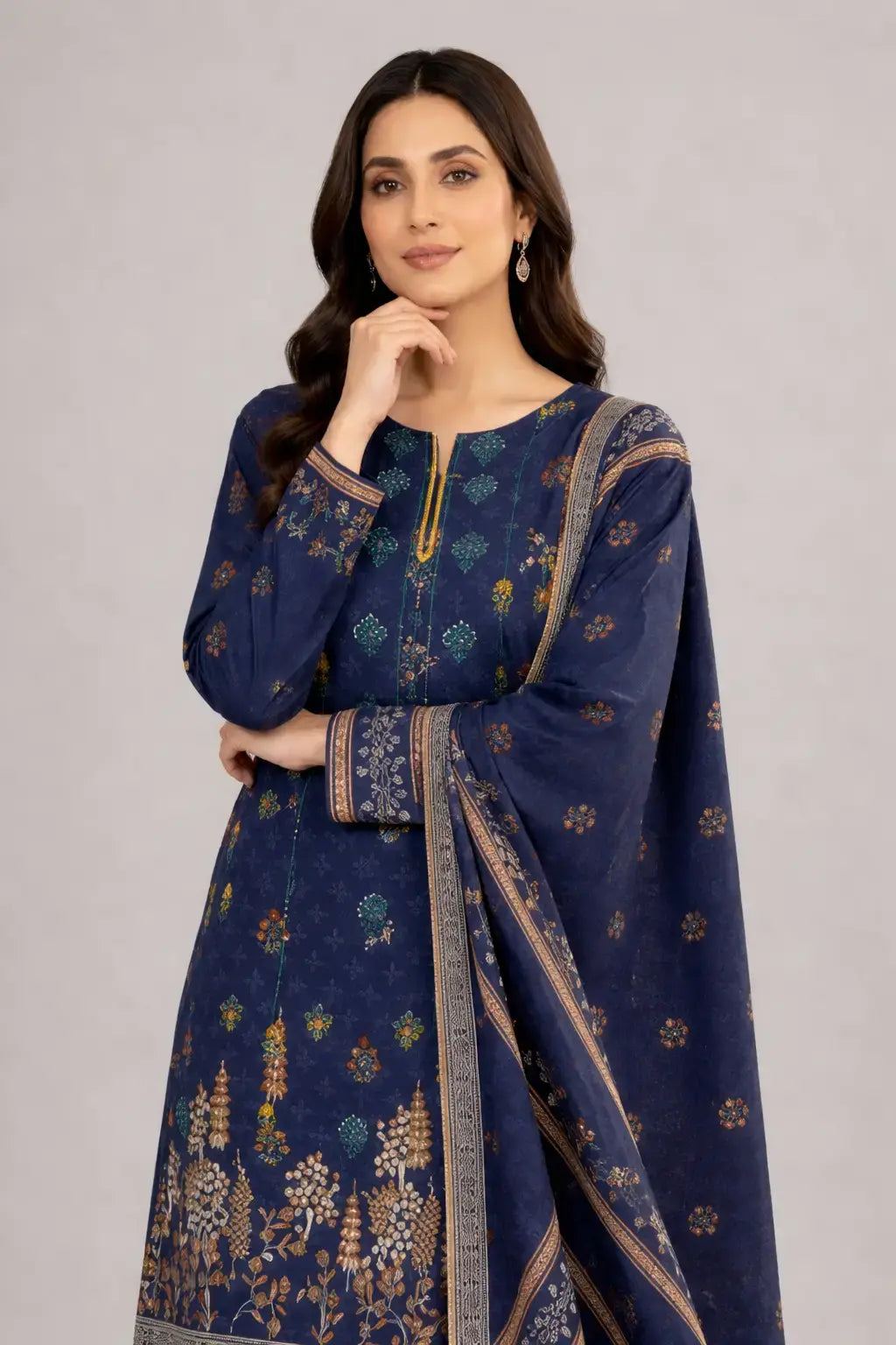 Woman wearing a dark blue Bin Saeed lawn dress with printed border dupatta and plain trouser.