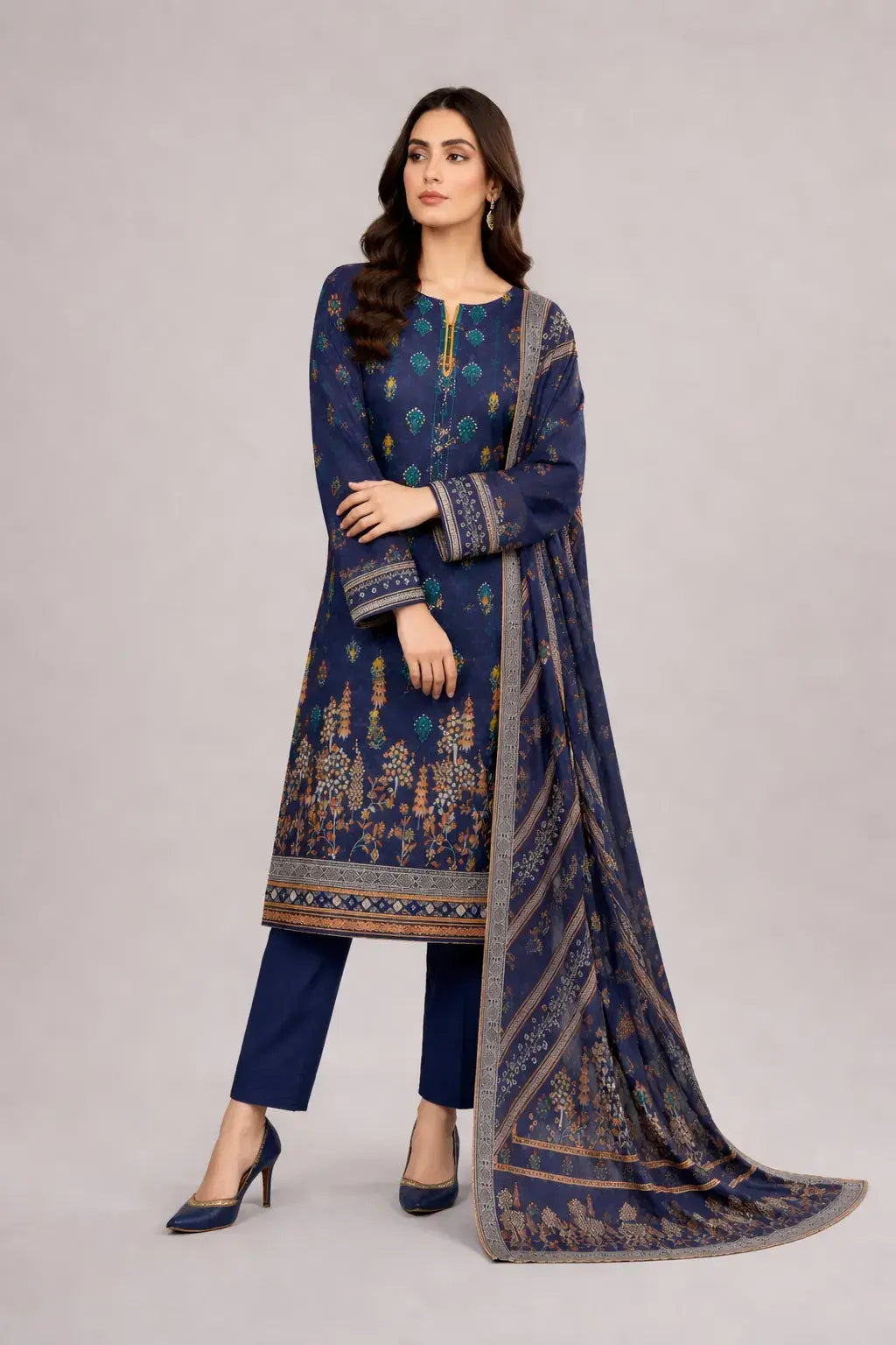 Woman wearing a navy blue luxury lawn dress design. Wearing Plain blue trouser