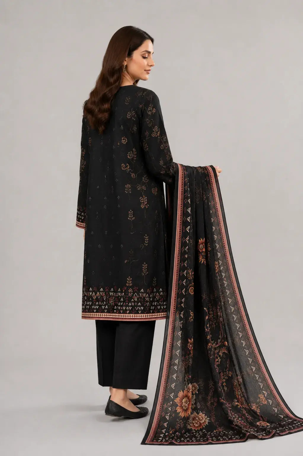 Woman wearing a black Bin Saeed dress design with a matching dupatta