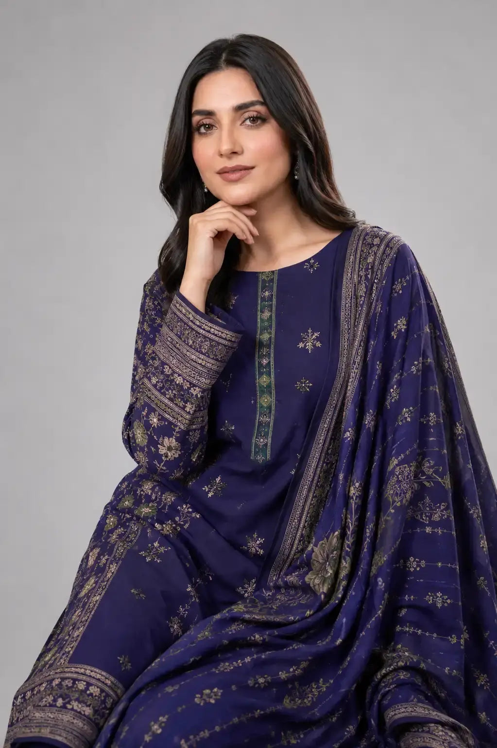 Woman wearing Bin saeed lawn design in blue outfit with intricate patterns