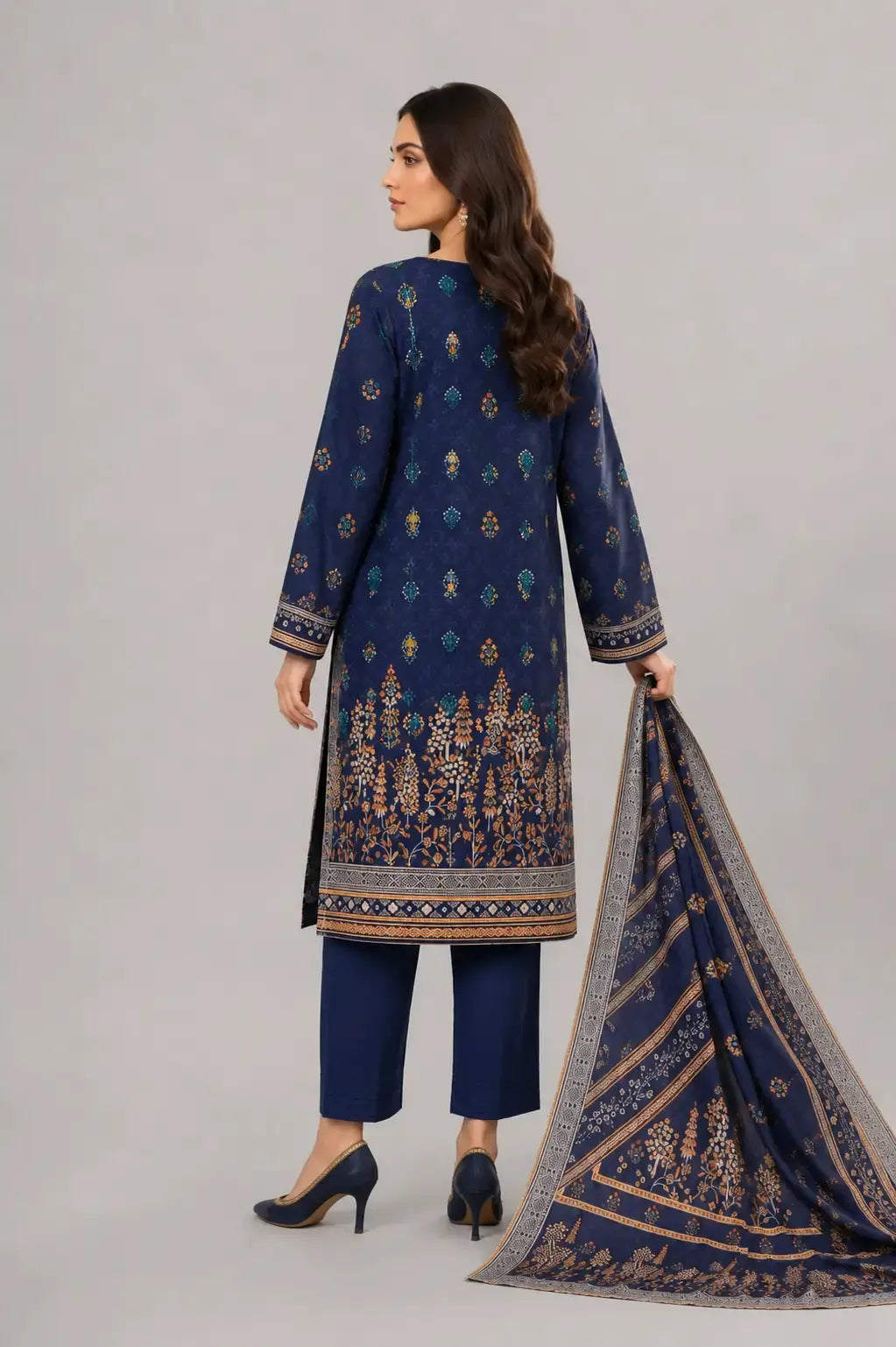 Woman wearing a navy blue printed outfit with a matching dupatta and plain trouser