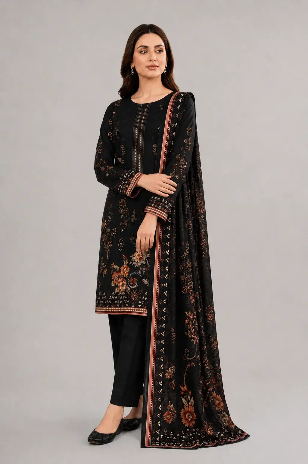 Woman wearing a black outfit with a matching dupatta