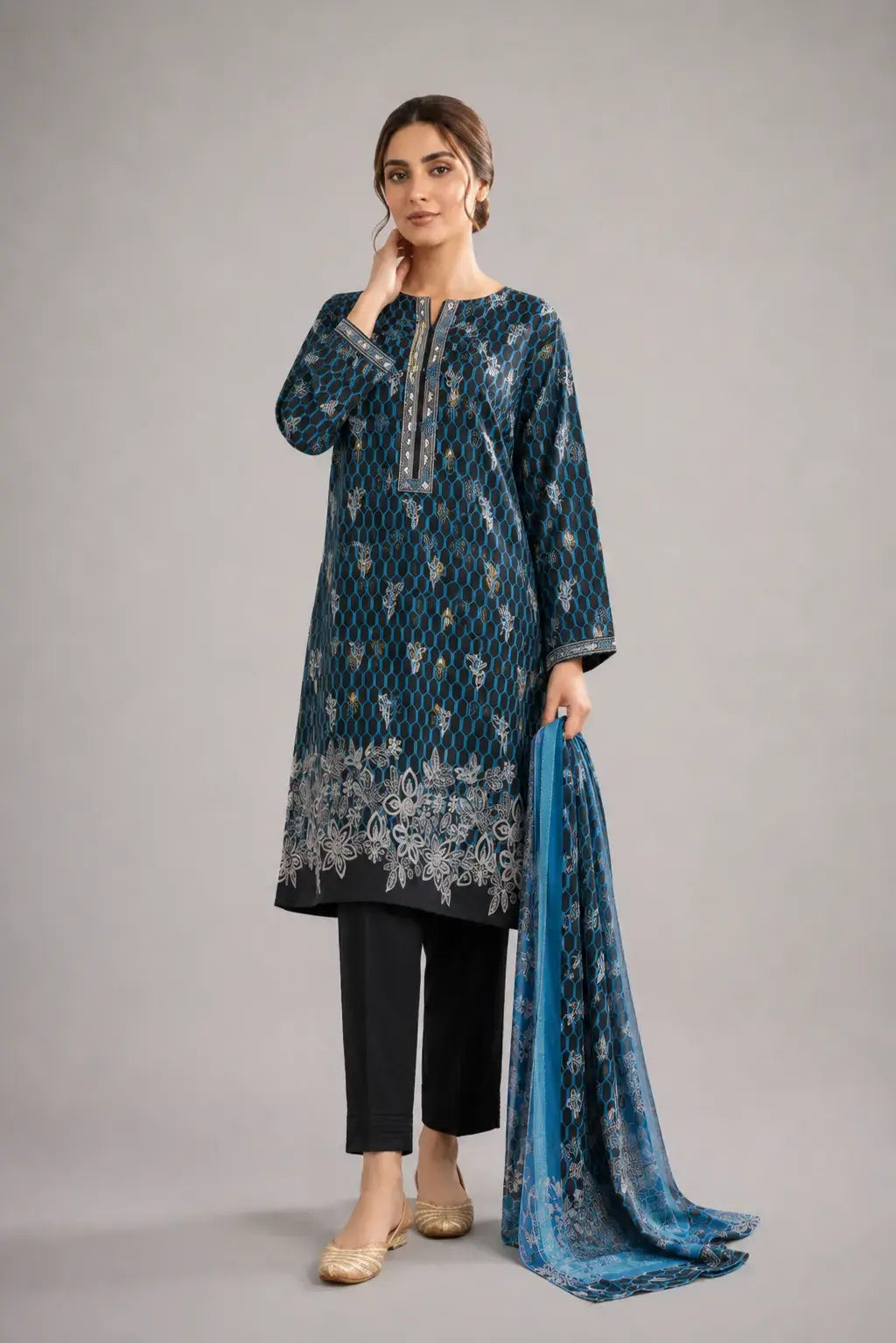 Woman wearing a blue digital printed kurta with black pants and a matching dupatta in luxury lawn fabric