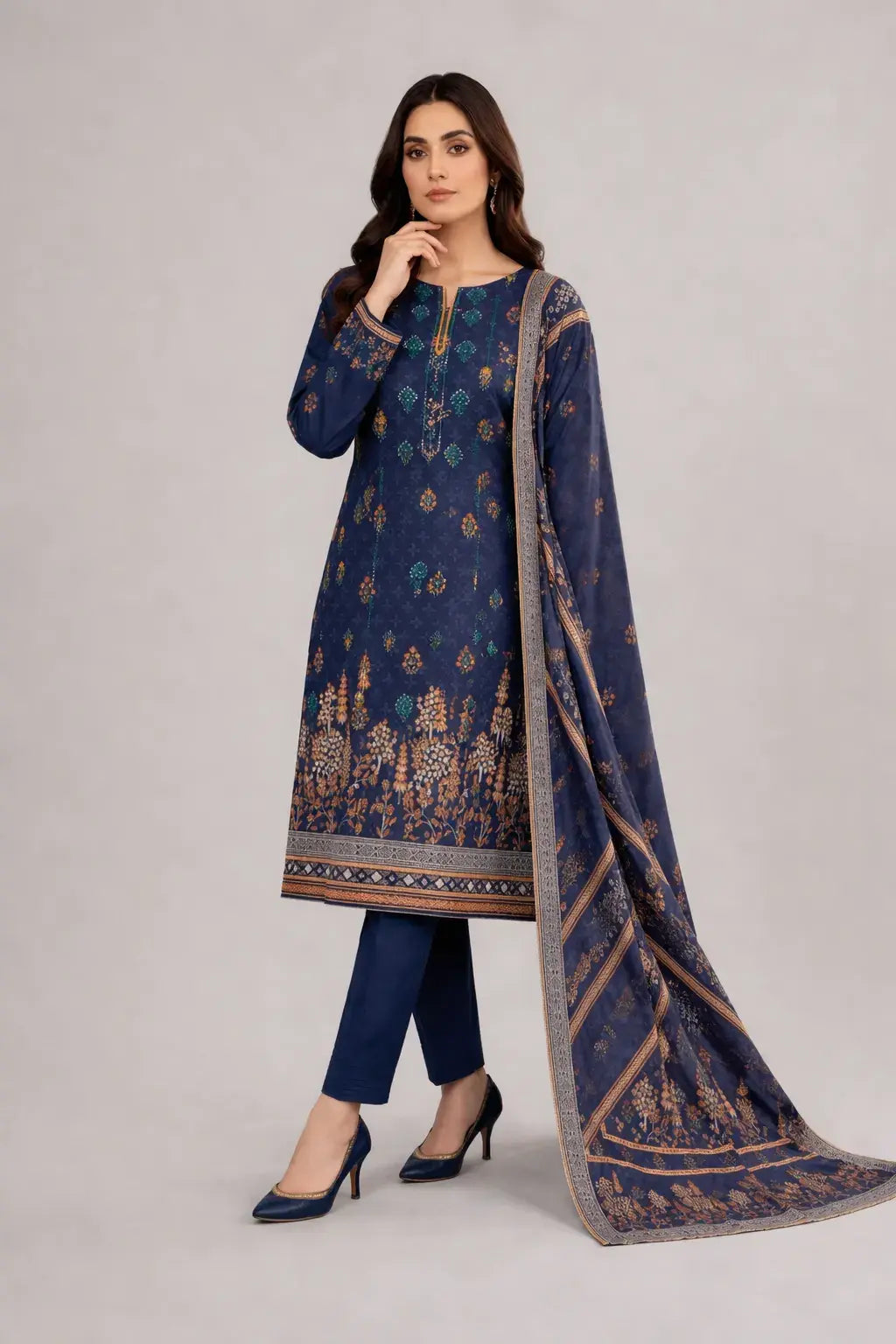 Woman wearing a navy blue Bin Saeed lawn sale article with a matching dupatta on a light gray background