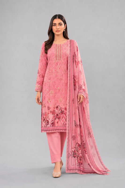 Woman wearing a pink traditional Pakistani dress with a matching dupatta