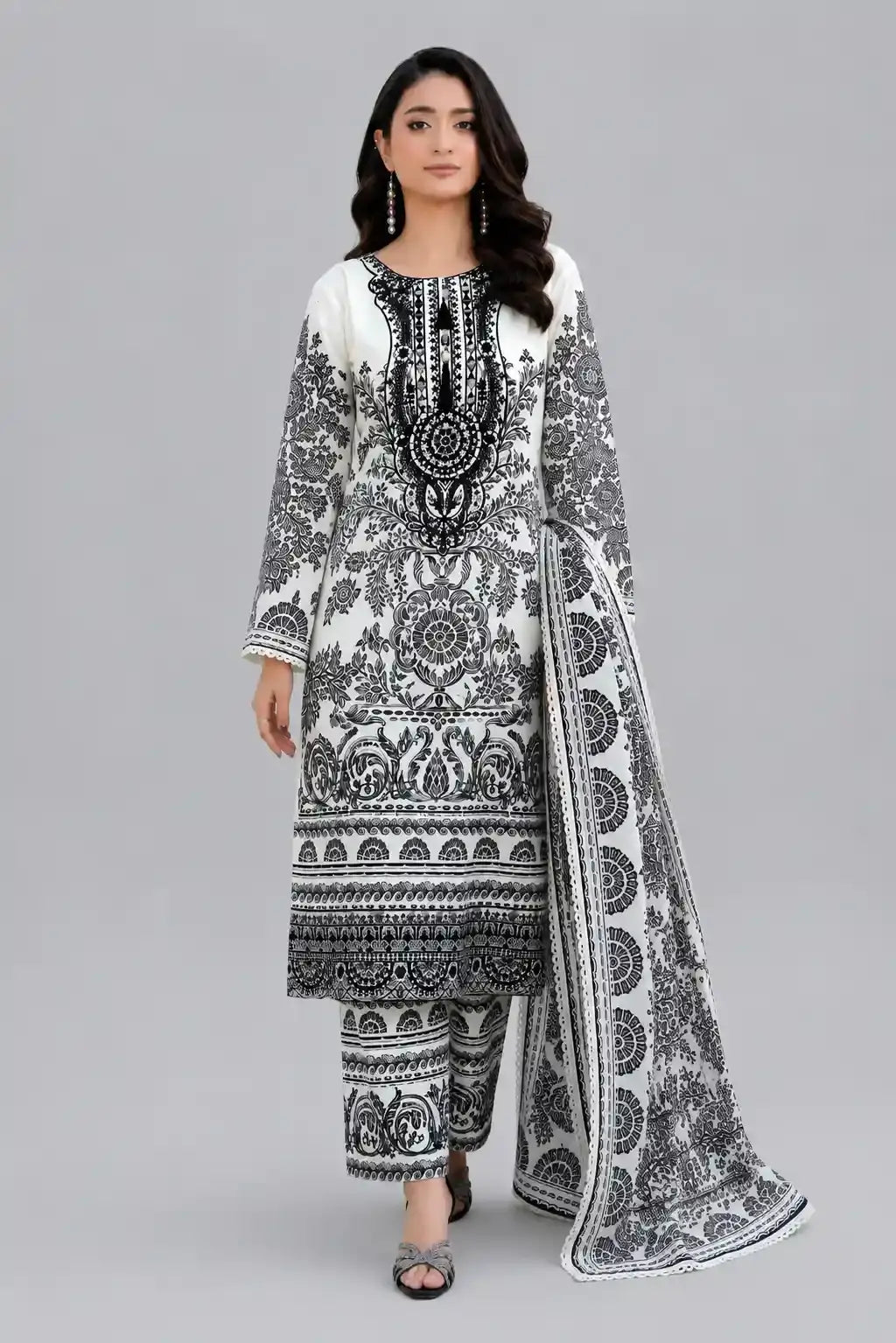 Woman wearing a black and white printed with a dupatta and plain matching trouser