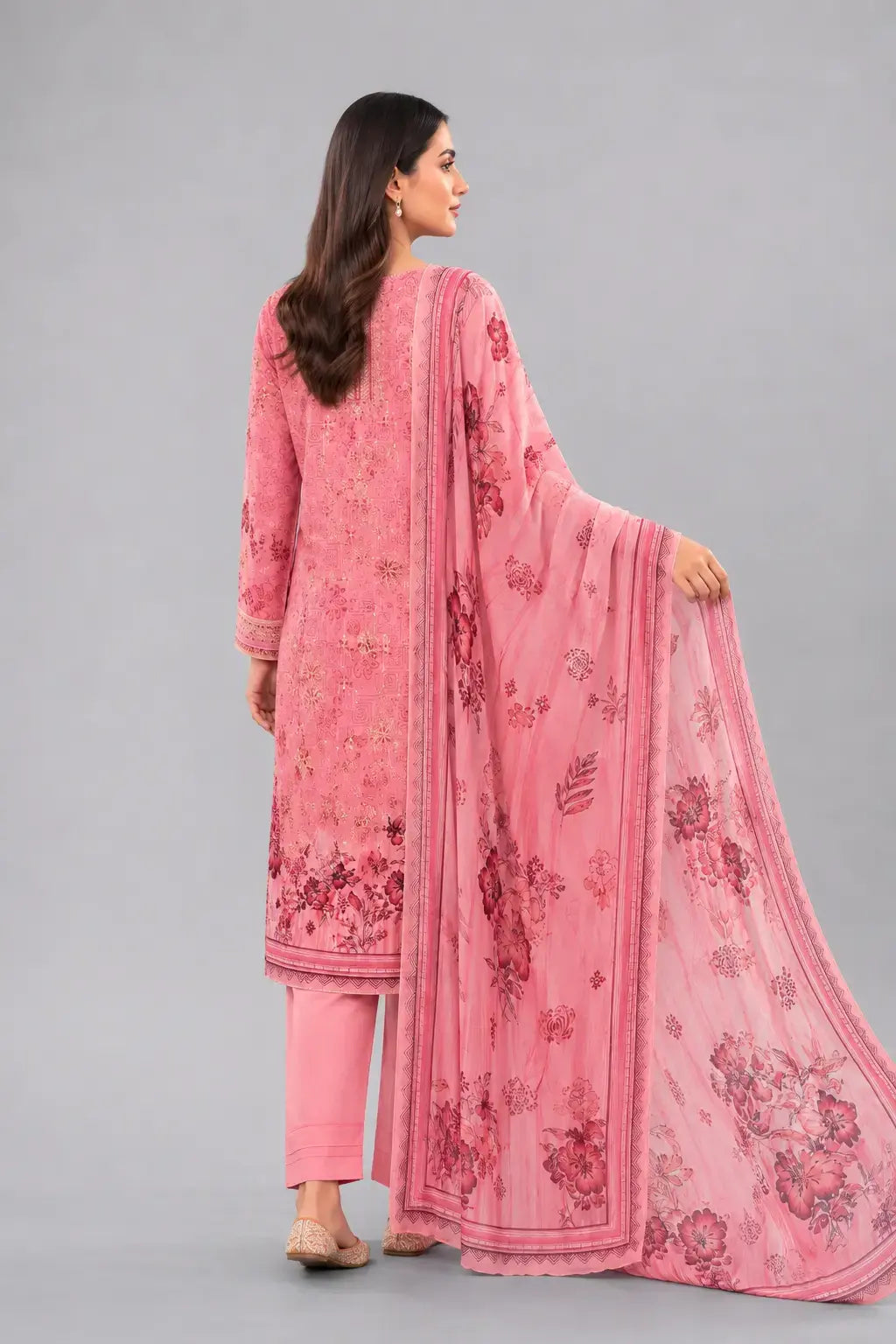 Woman wearing a pink digital print luxury lawn Bin Saeed design